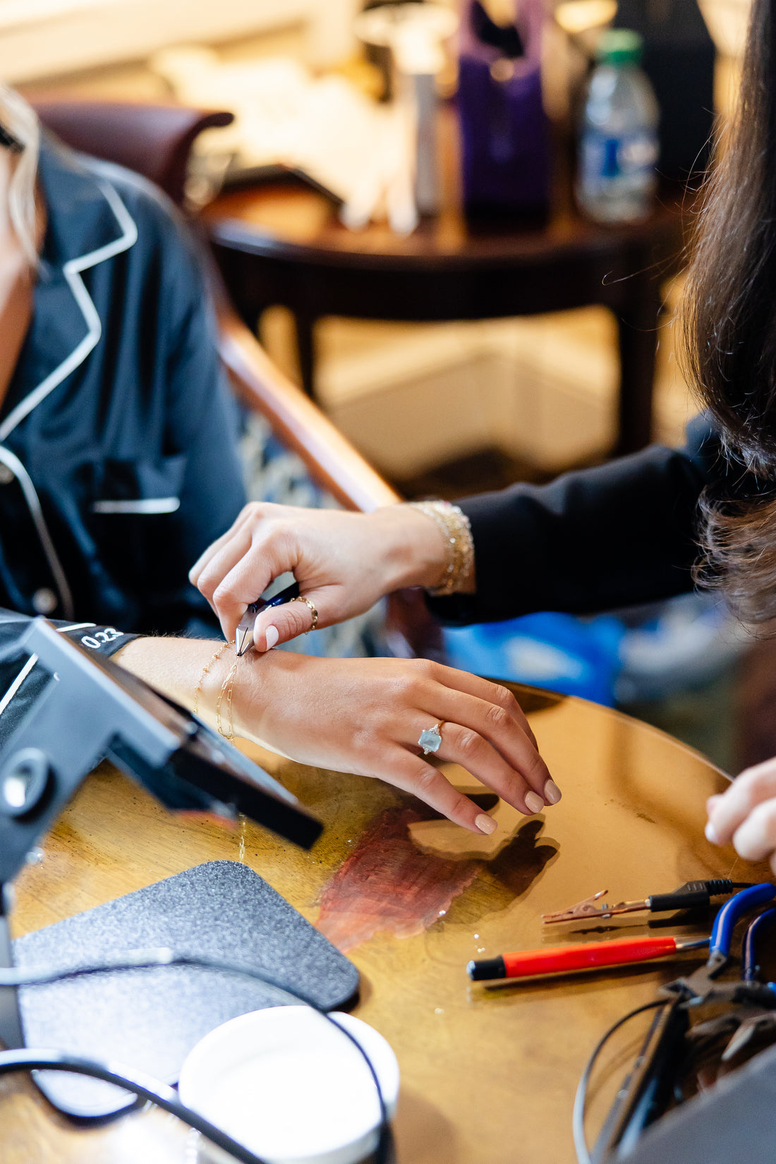A permanent bracelet being affixed around a wrist
